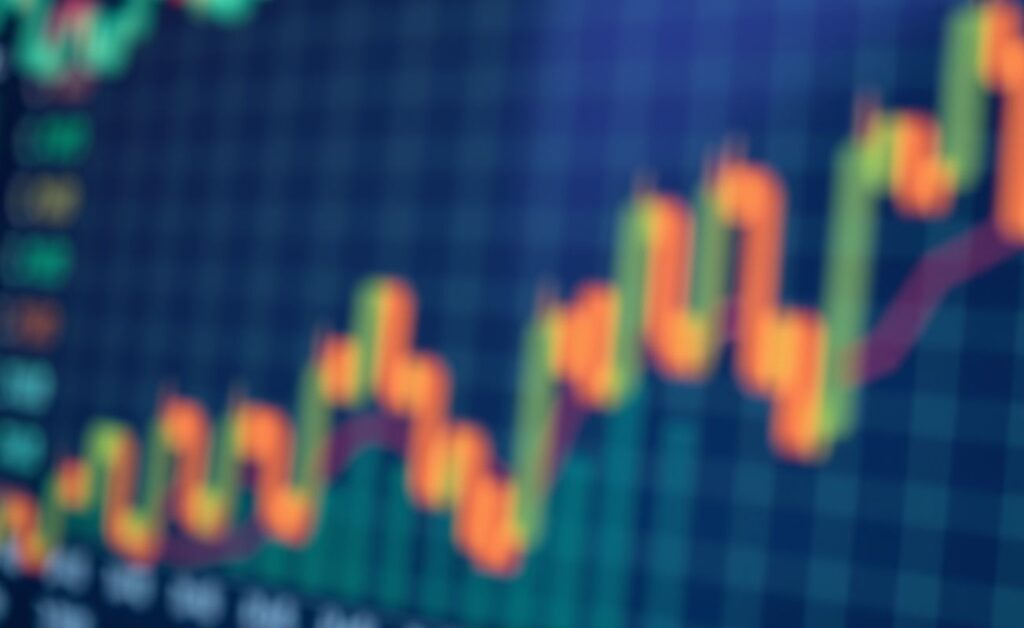 Gráfico financeiro desfocado ao fundo